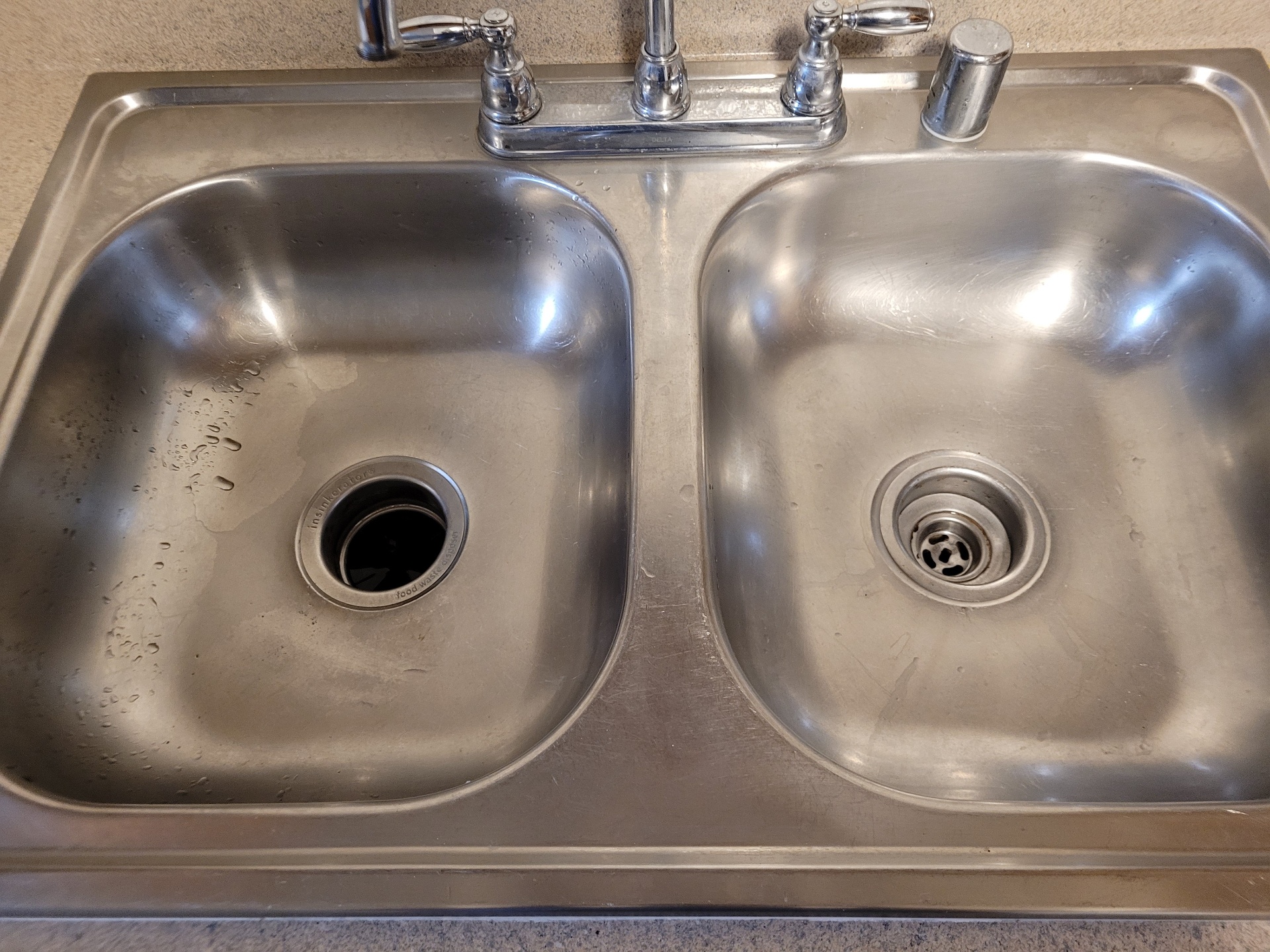 Clean stainless kitchen sink after cleaning